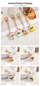 Set of four cute Maneki Neko keychains with gold metal hooks and lucky charms