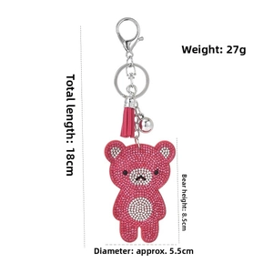 Détail porte-clés ours en strass avec dimensions de 18cm de long et poids de 27g