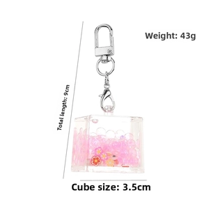 Detailed size view of square acrylic liquid quicksand keychain with pink floral glitter