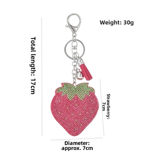 Sparkling pink rhinestone strawberry keychain with tassel and dimensions of 17cm and 30g