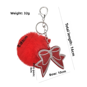 Détails du porte-clés nœud en strass rouge et pompon avec dimensions