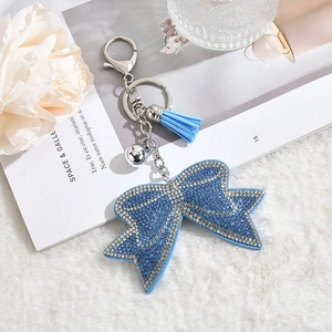 Porte-clés nœud en strass bleu avec pompon et clochette argentée pour sacs à main