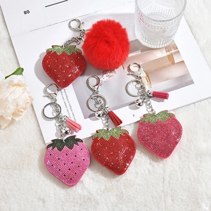 Sparkling strawberry keychain with red rhinestones, silk tassel and fluffy pompom charm
