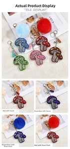 Detail of mushroom keychains with rhinestones, colorful tassels and faux fur pom poms