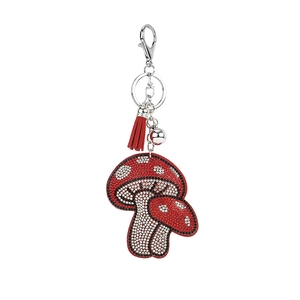 Sparkling rhinestone mushroom keychain with red tassel and silver bell bag charm