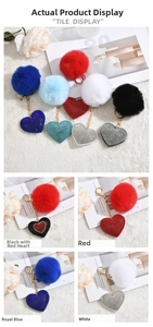 Detail of plush heart keychains with rhinestone bases and soft faux fur pom poms