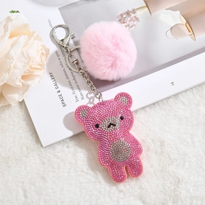 Sparkly pink rhinestone bear keychain with a fluffy fur ball and silver metal clasp