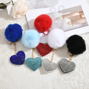 Sparkling rhinestone heart keychains with velvet plush poms in five assorted colors