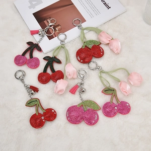Sparkling rhinestone cherry keychain set in multiple colors with tassels and bells