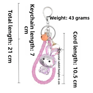 Detail view of pink acrylic rabbit keychain with dimensions and sparkling rhinestone strap
