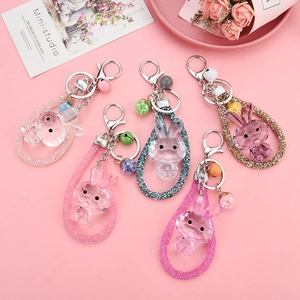 Faceted acrylic crystal rabbit keychains in five colors with bells and matching straps