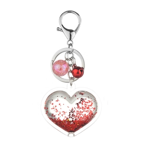 Acrylic heart keychain with red liquid glitter, pink bead, and small red bell
