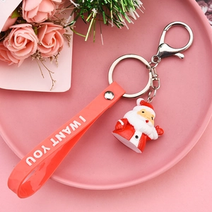 Close-up of Santa Claus keychain with silicone wristband and silver metal clip