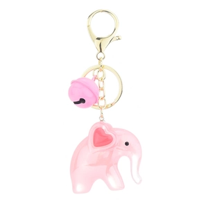 Pink acrylic jelly elephant keychain with bell and heart detail on white background
