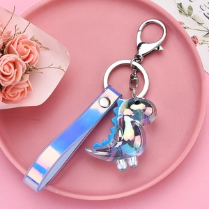 Detail of holographic acrylic dinosaur keychain with matching strap and silver lobster clasp