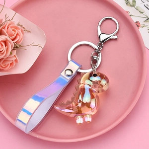 Charming iridescent acrylic dinosaur keychain with silver metal clasp and laser strap