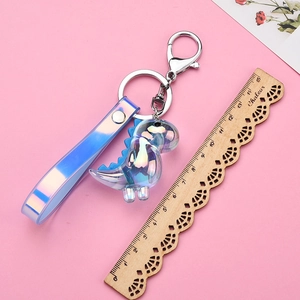 Macro view of gradient laser acrylic dinosaur keychain with silver metal lobster clasp