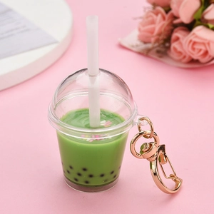 Detailed close-up of matcha green bubble tea keychain with rose gold lobster clasp