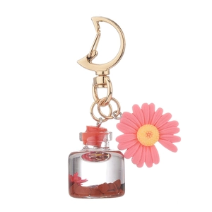 Creative moon clasp keychain with pink daisy flower charm and clear glass wish bottle