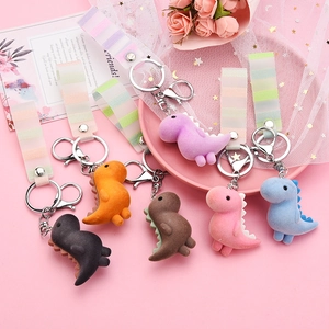 Flocked acrylic dinosaur keychain collection with colorful braided straps for bags