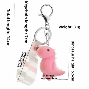 Detailed view of pink flocked dinosaur keychain with striped wrist strap and dimensions