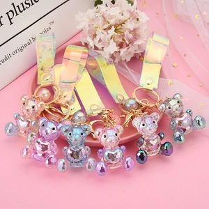 Colorful faceted acrylic bear keychains with iridescent straps and heart motifs