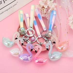 Iridescent swan acrylic keychains with colorful holographic wrist straps in six vibrant colors