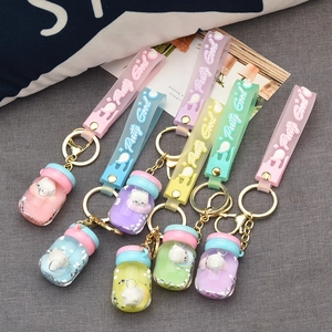 Five colorful acrylic liquid oil yogurt bottle keychains with cute cat and star sequins