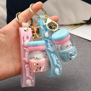 Cute acrylic oil-filled cat drifting bottle keychains in pink and sky blue colors