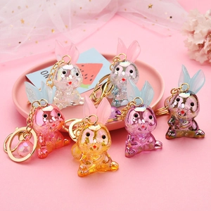 Porte-clés lapins en acrylique translucide coloré avec paillettes et anneaux dorés en 6 tons