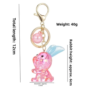 Porte-clés lapin en acrylique dégradé rose avec fermoir doré et détail de perle