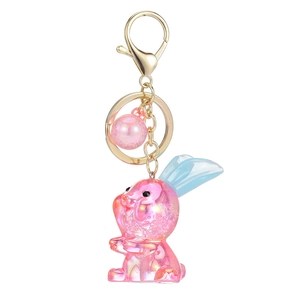 Porte-clés lapin en acrylique rose irisé avec oreilles bleues et pendentif perle