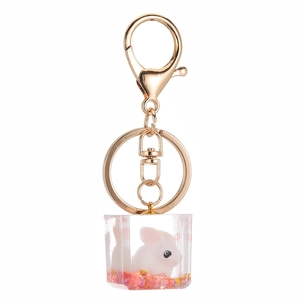 Cute white bunny acrylic keychain with gold clasp and pink glitter cube pendant