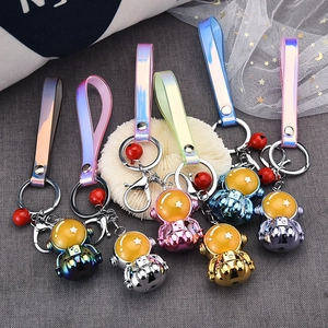 Colorful astronaut keychains with metallic plating and laser PU straps in seven bright colors
