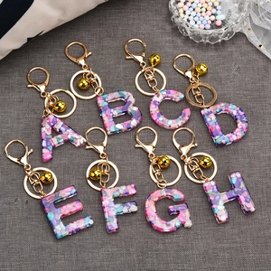 Colorful resin alphabet keychains A-H with gold lobster clasps and bells for bags