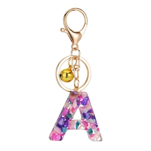Creative resin letter A keychain with colorful stone fillings and gold bell charm