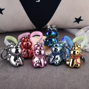Set of 6 metallic unicorn keychains with colorful silicone straps and small bells