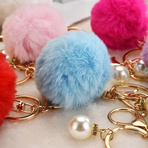 Colorful faux rabbit fur pom pom keychains with gold metal rings and pearl charms