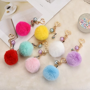 Faux rabbit fur ball keychain with golden heart clasp and pearl milk tea cup charm