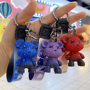 Three acrylic keychain bear charms with starry gradient finish and fashion lanyards