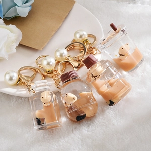 Brown bear milk tea liquid quicksand keychain set with four different bottle shapes