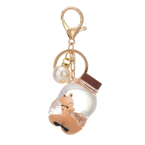 Quicksand milk tea bottle keychain with floating cartoon animal and pearl charm accessory