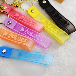 Detailed close-up of colorful translucent silicone bear keychains with gold metal hardware