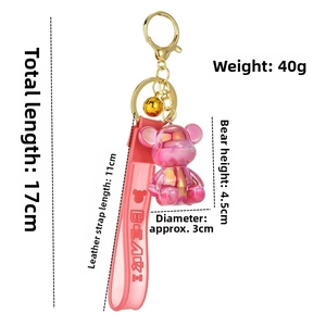 Pink metallic bear keychain with leather strap and bell, size 17cm and weight 40g