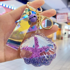 Purple shell keychain with liquid oil Eiffel Tower and holographic laser strap design