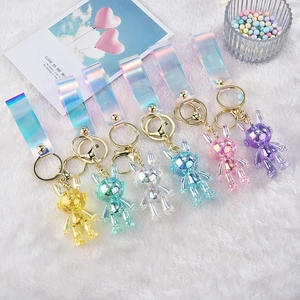Set of 6 colorful acrylic space bunny keychains with metallic finish and laser PVC straps