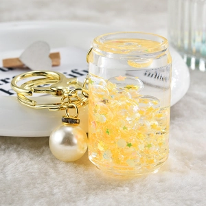 Creative drifting bottle can keychain with yellow liquid and star sequins
