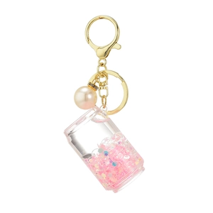 Quicksand bottle keychain with pink liquid, gold lobster clasp and white pearl detail