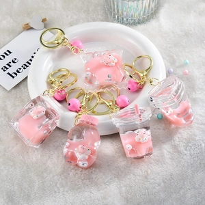 5-piece set of pink acrylic liquid quicksand keychains with cartoon bear and star glitter
