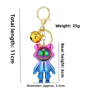 Detail view of astronaut bear keychain with dimensions 11cm length and 6cm height